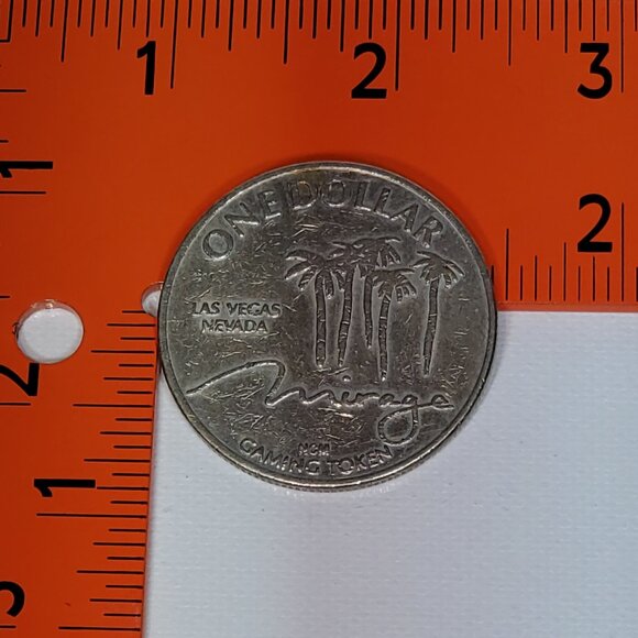 VINTAGE MIRAGE CASINO SILVER ONE DOLLAR GAMING TOKEN 1989 BY NEVADA COIN MINTING - Picture 4 of 4